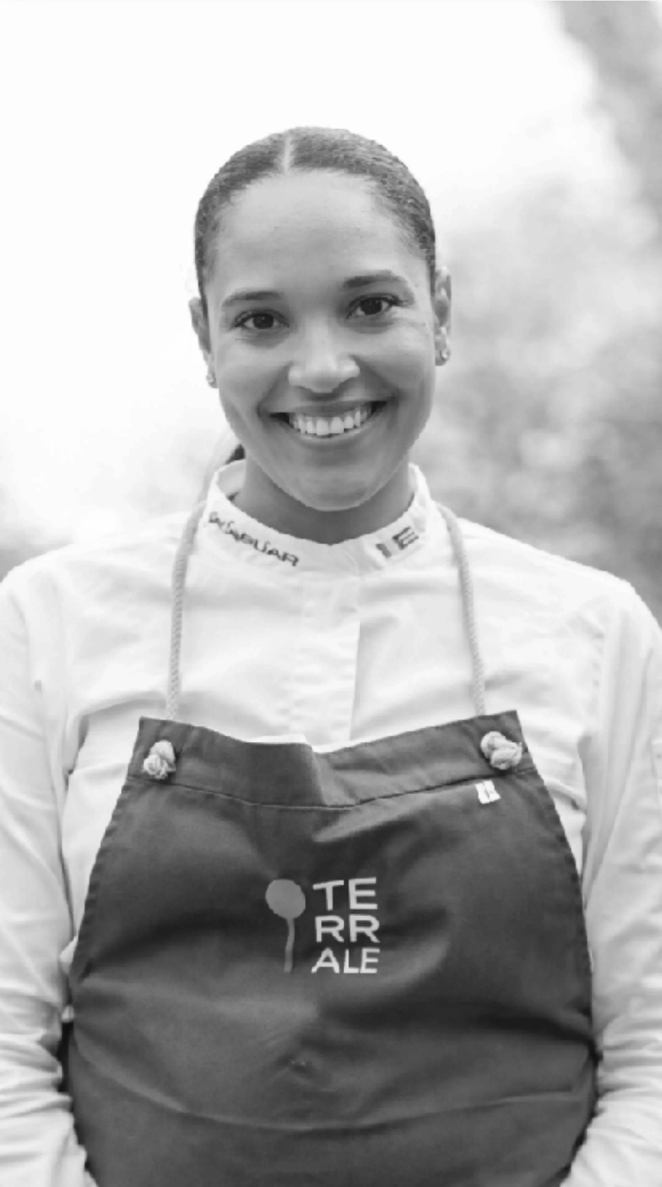 Saylem, black and white, in chef whites with arms crossed
