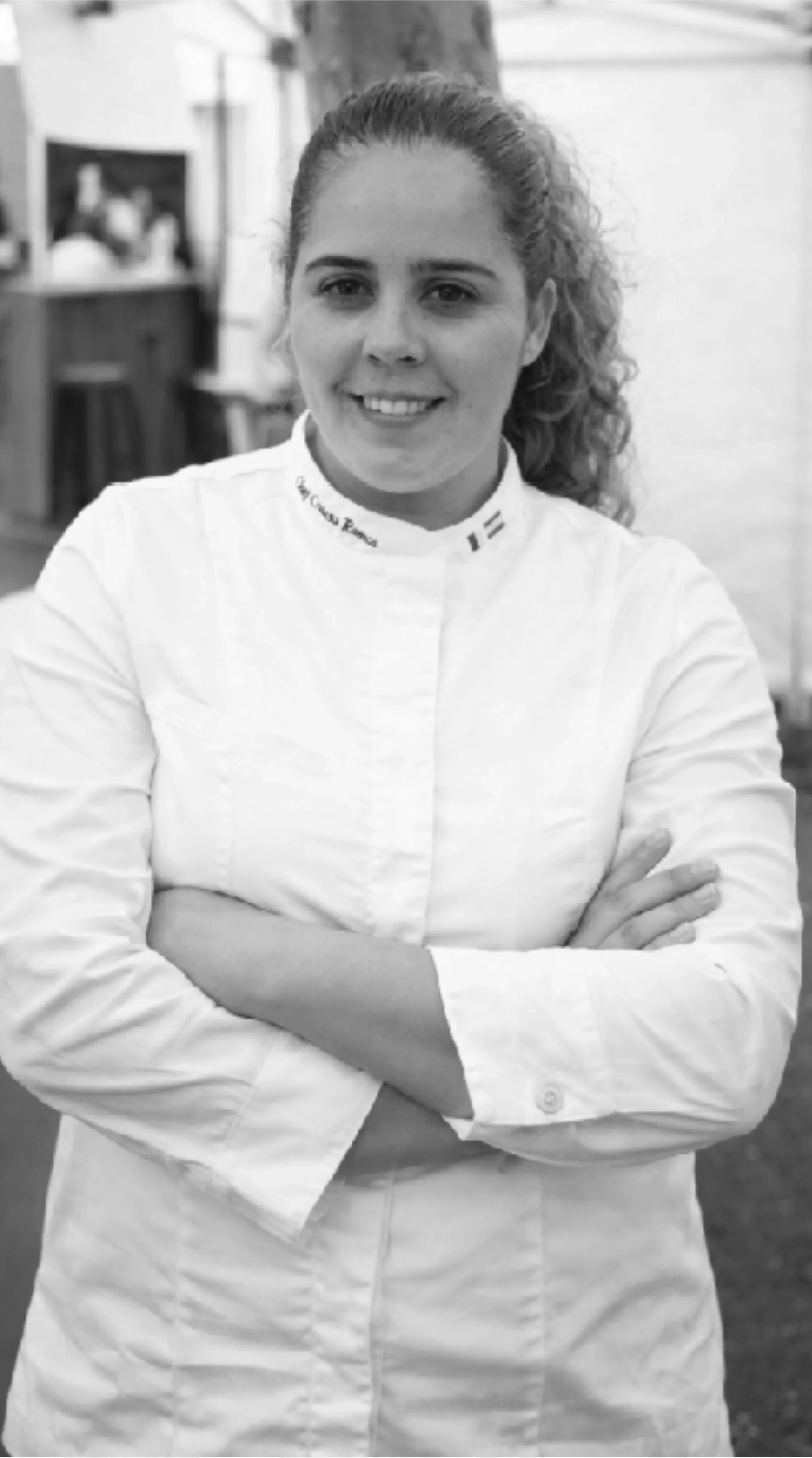 Creusa, black and white, wearing a Terrale apron